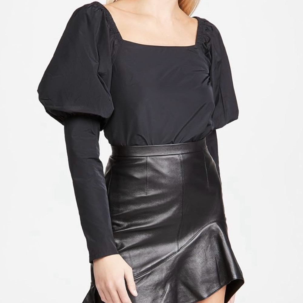 The Andamane “Elsa Top.” Black, non-stretch. Square neckline with puff sleeves.